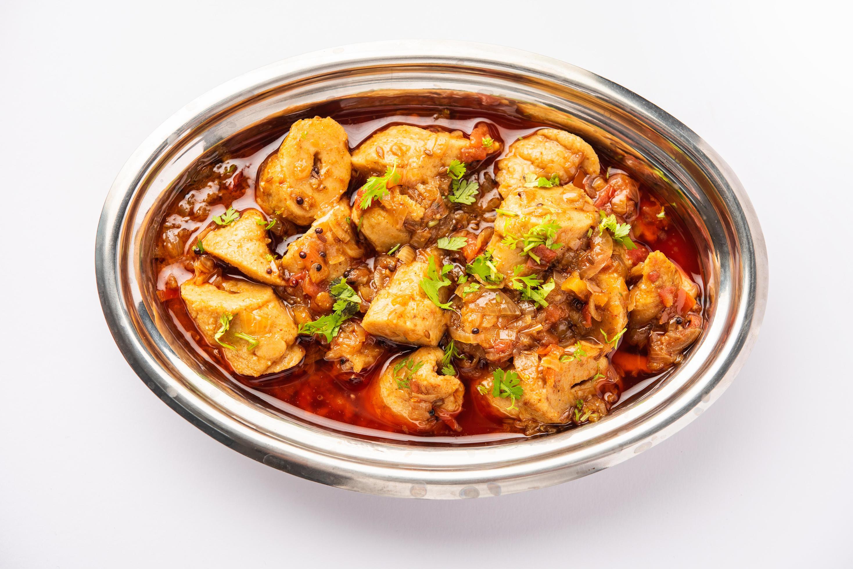 Punjabi soya chaap gravy or dhaba style soya chap masala sabzi served with  naan 16286238 Stock Photo at Vecteezy