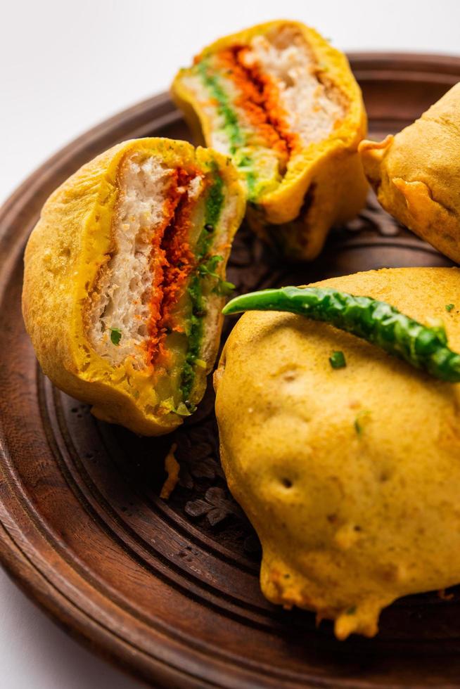 Ulta Vada Pav is made with a spicy potato stuffed bun photo