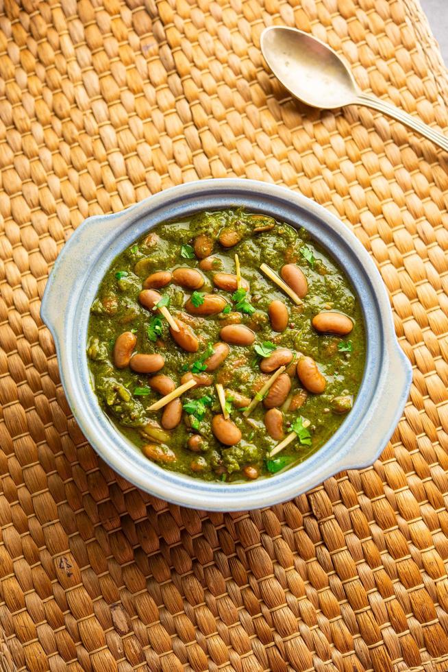 Palak rajma Masala is an Indian curry prepared with red kidney beans and spinach cooked with spices photo