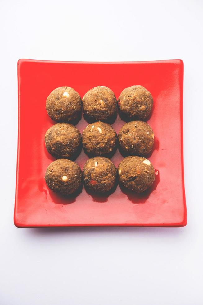 Bajra Atta Ladoo or kuler laddoo - Millet Flour Laddu, a popular winter sweet snack food from India photo