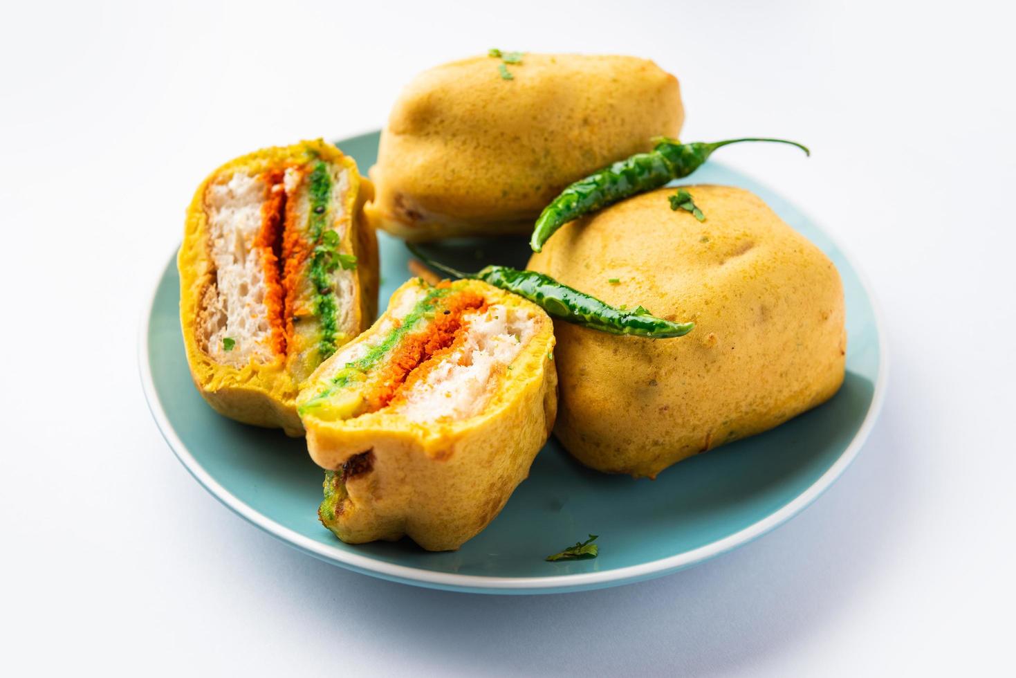 Ulta Vada Pav is made with a spicy potato stuffed bun, called pav inside vada, inside out vada pav photo