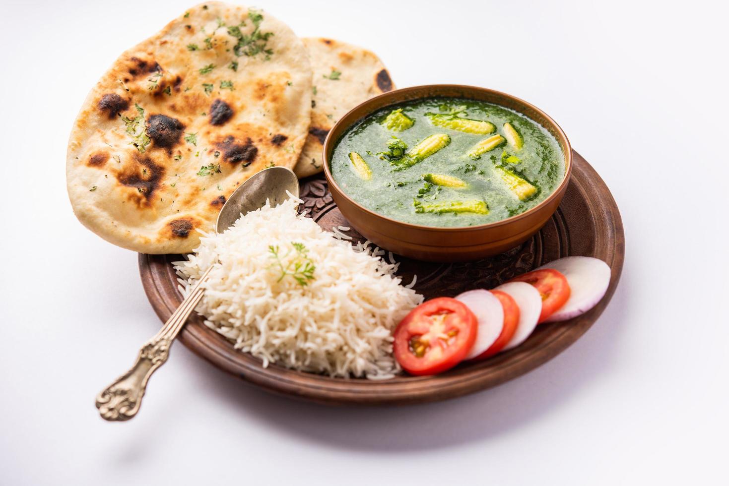 palak baby corn sabzi also known as spinach makai curry served with rice or roti, Indian food photo