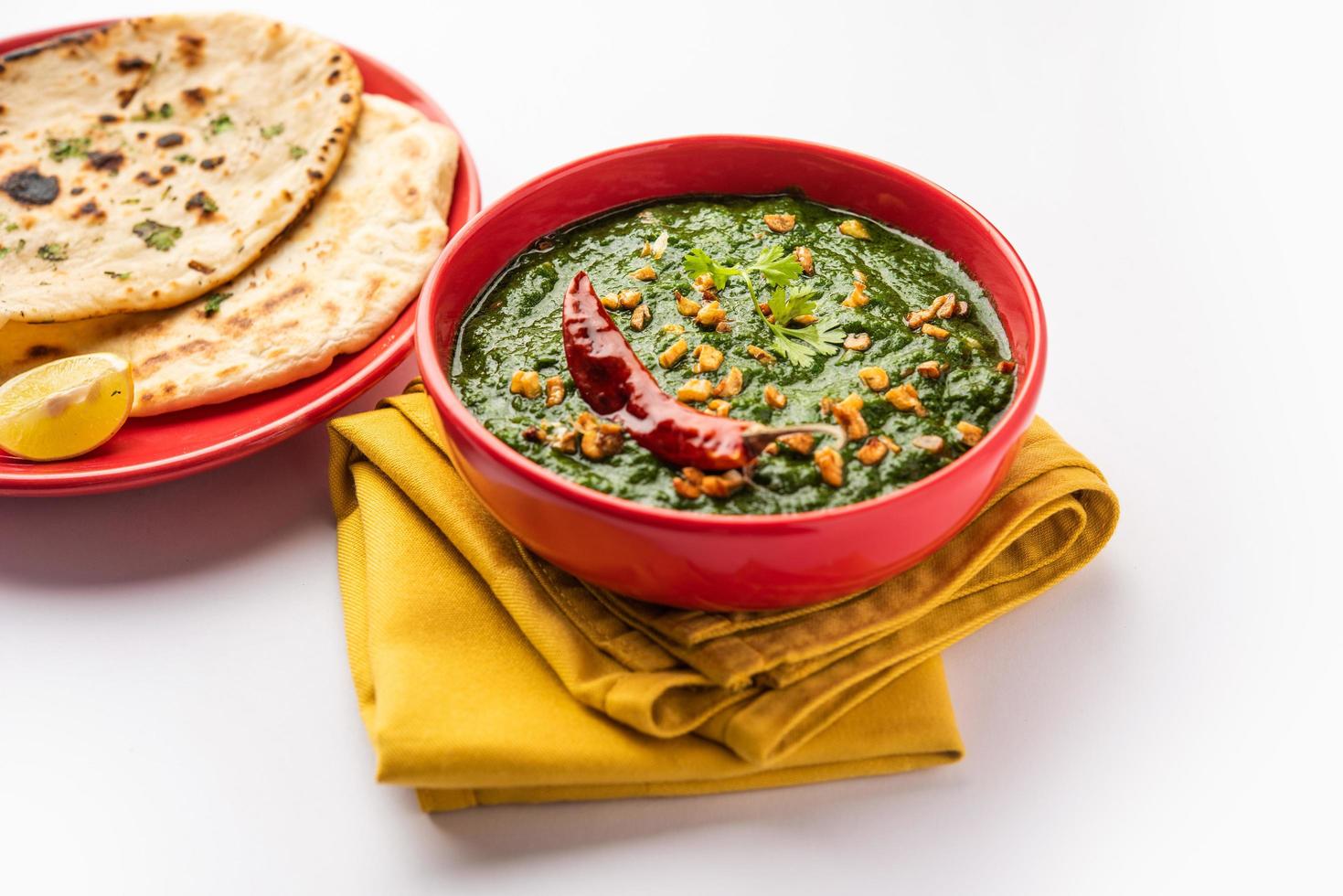 lasooni palak recipe or dhaba style garlic spinach curry, Indian main course served with naan photo