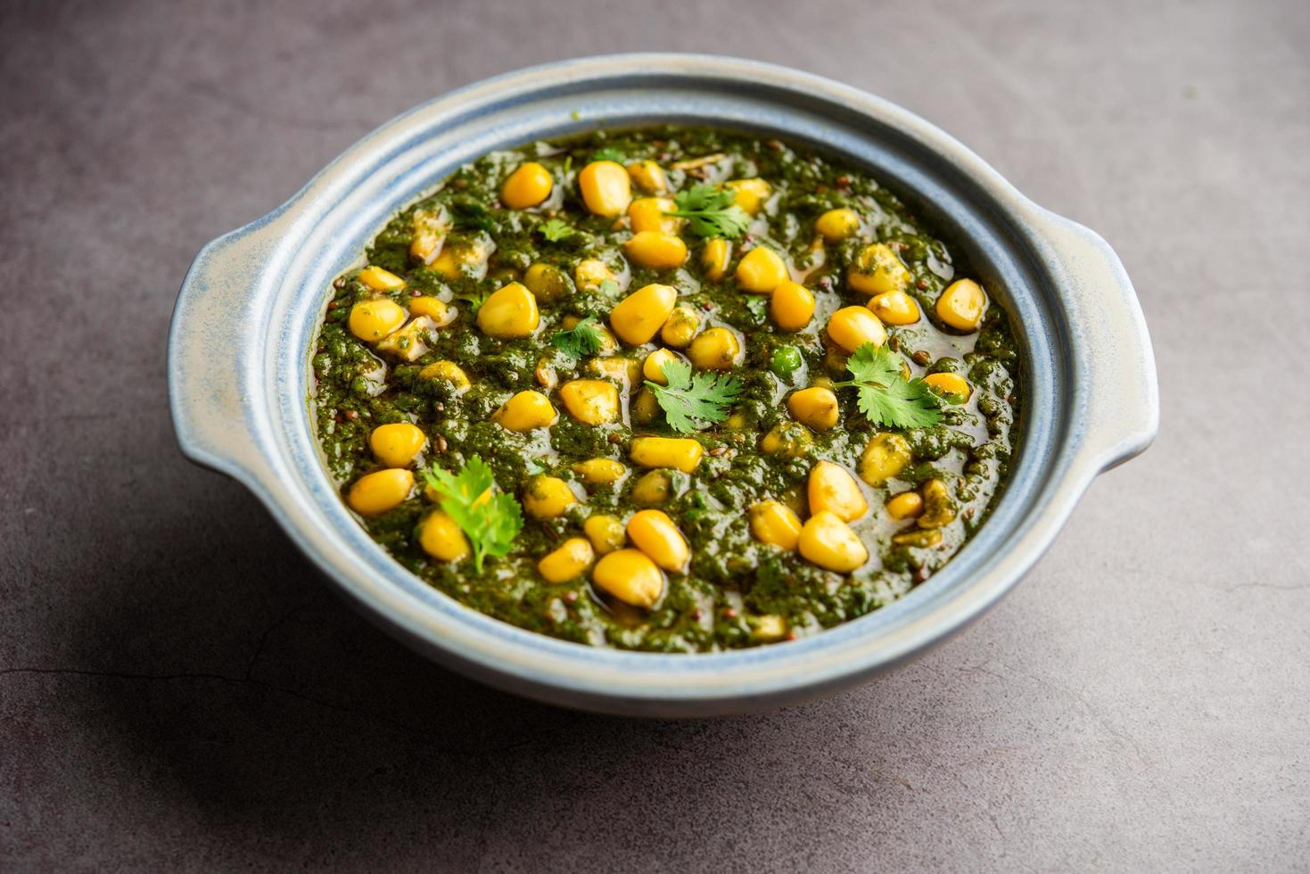 Palak sweet corn sabzi also known as Spinach Makai curry sabji, north Indian main course menu photo