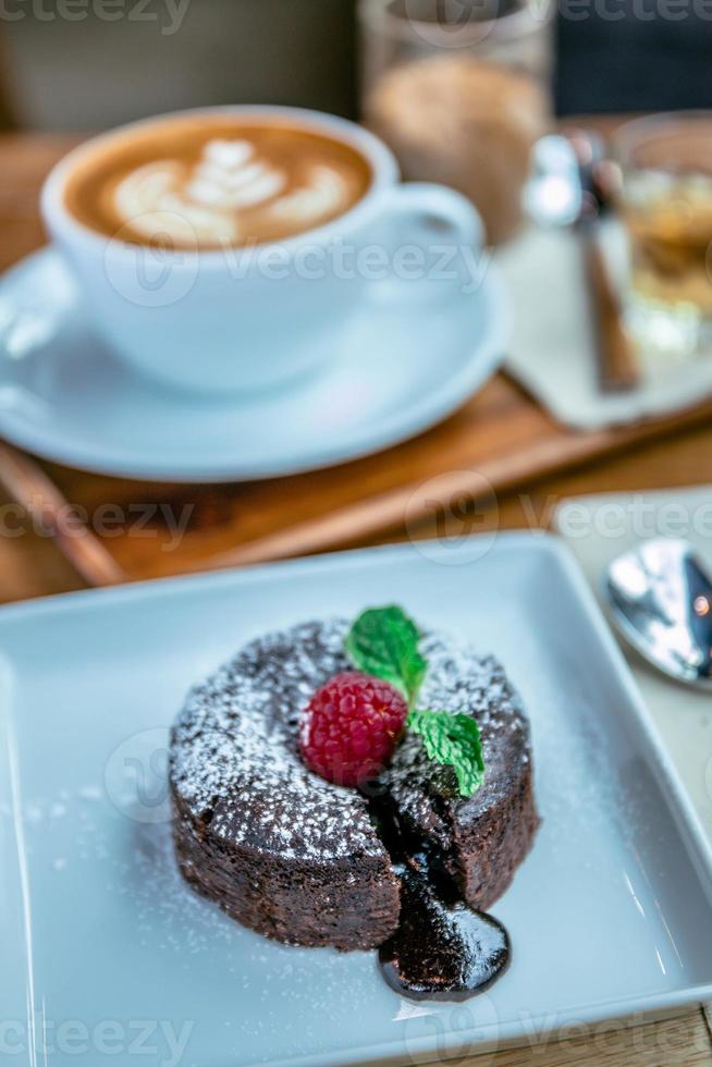 chocolate lave and raspberry fruit and pepper mint dessert in coffee cafe photo