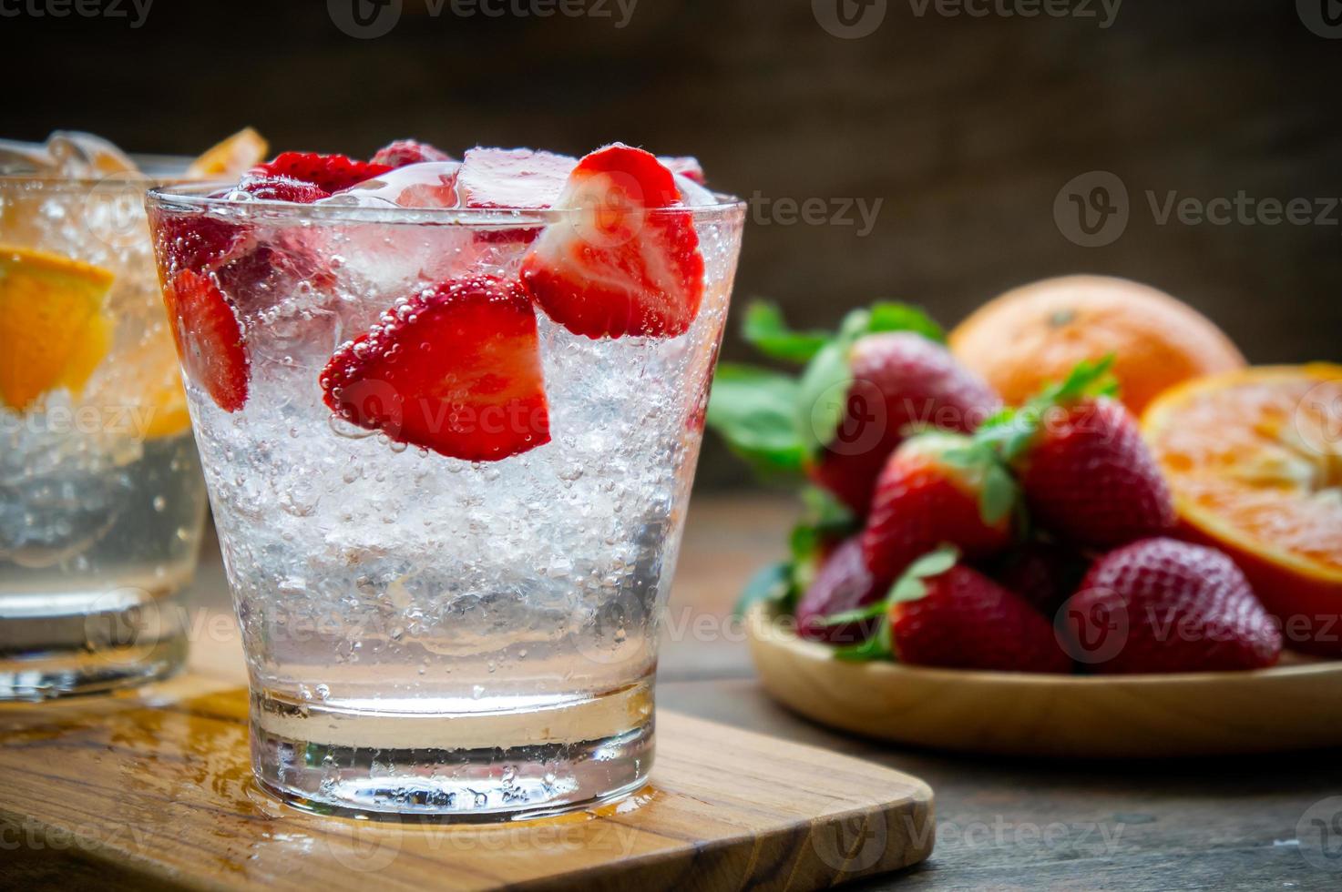 sweet fruits beverage strawberry soda and orange soda cold drink vitamin fruit, tasty drinks on wood table photo