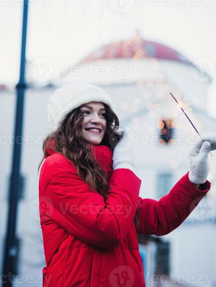 happy smiling girl walking on street with sparkles photo