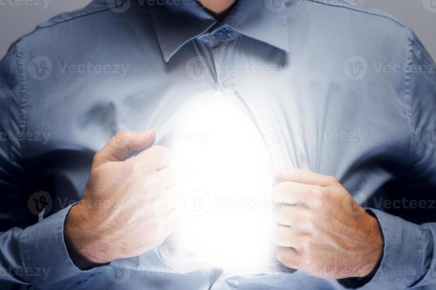 Man with shining inside his chest. Concepts of soul and personality. photo