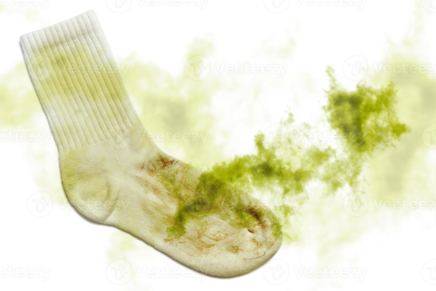 Smelly dirty sock on white background photo