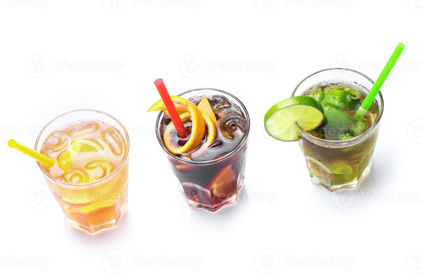 Glasses of different soft drinks or highball cocktails photo