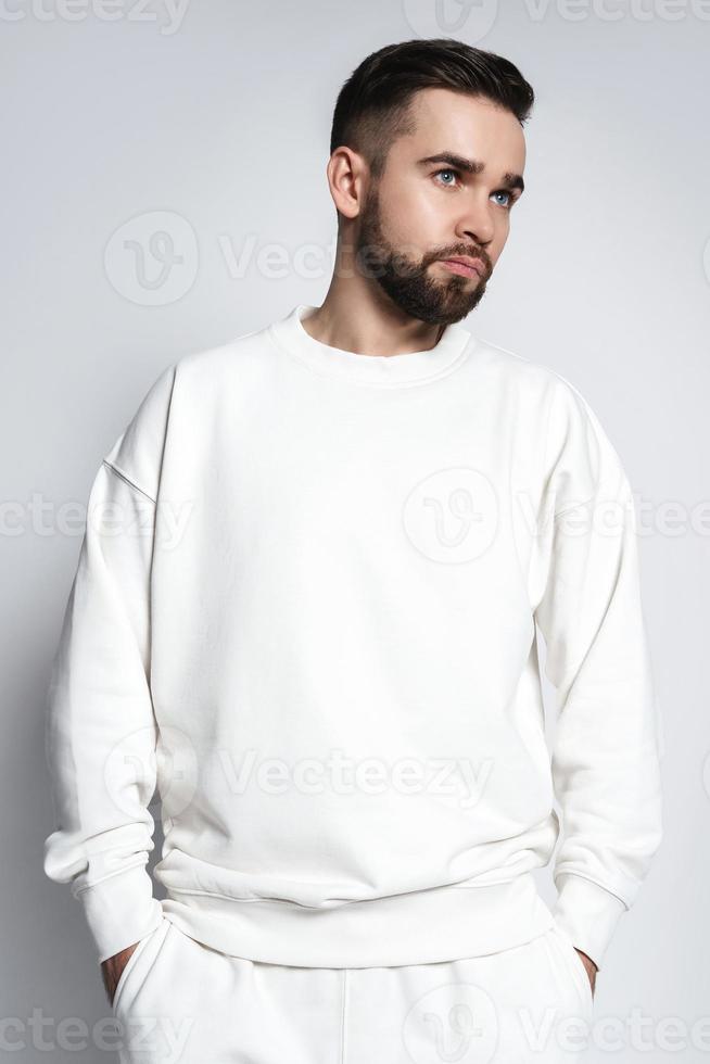 Handsome man wearing white sweatshirt photo