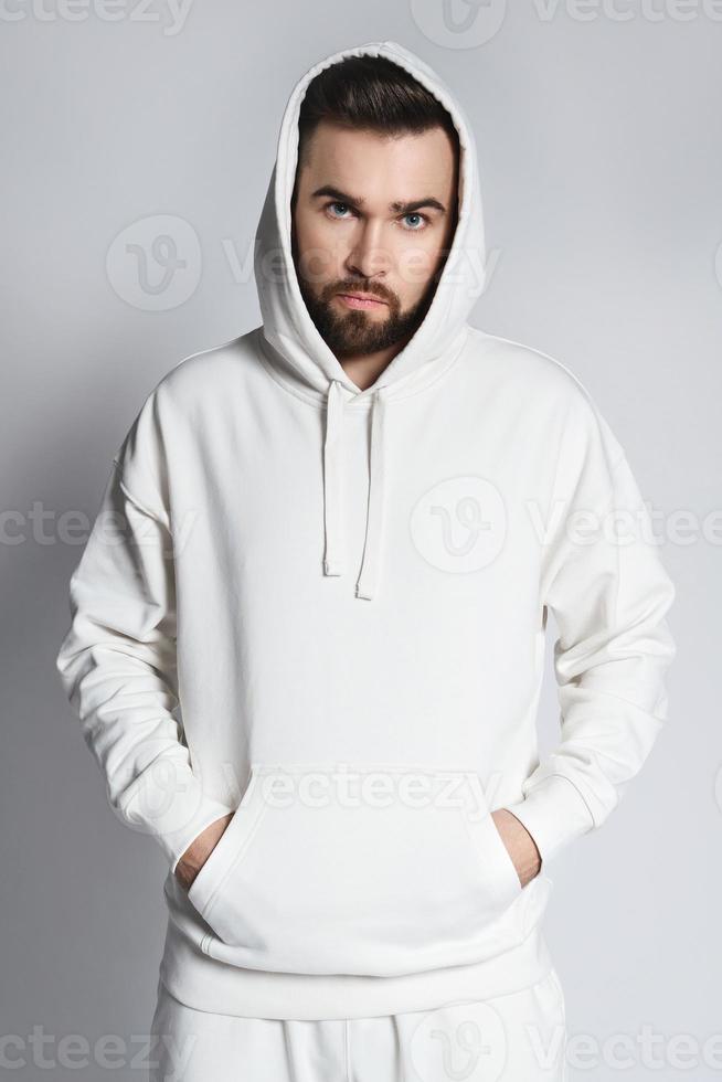 Handsome man wearing blank white hoodie and pants photo