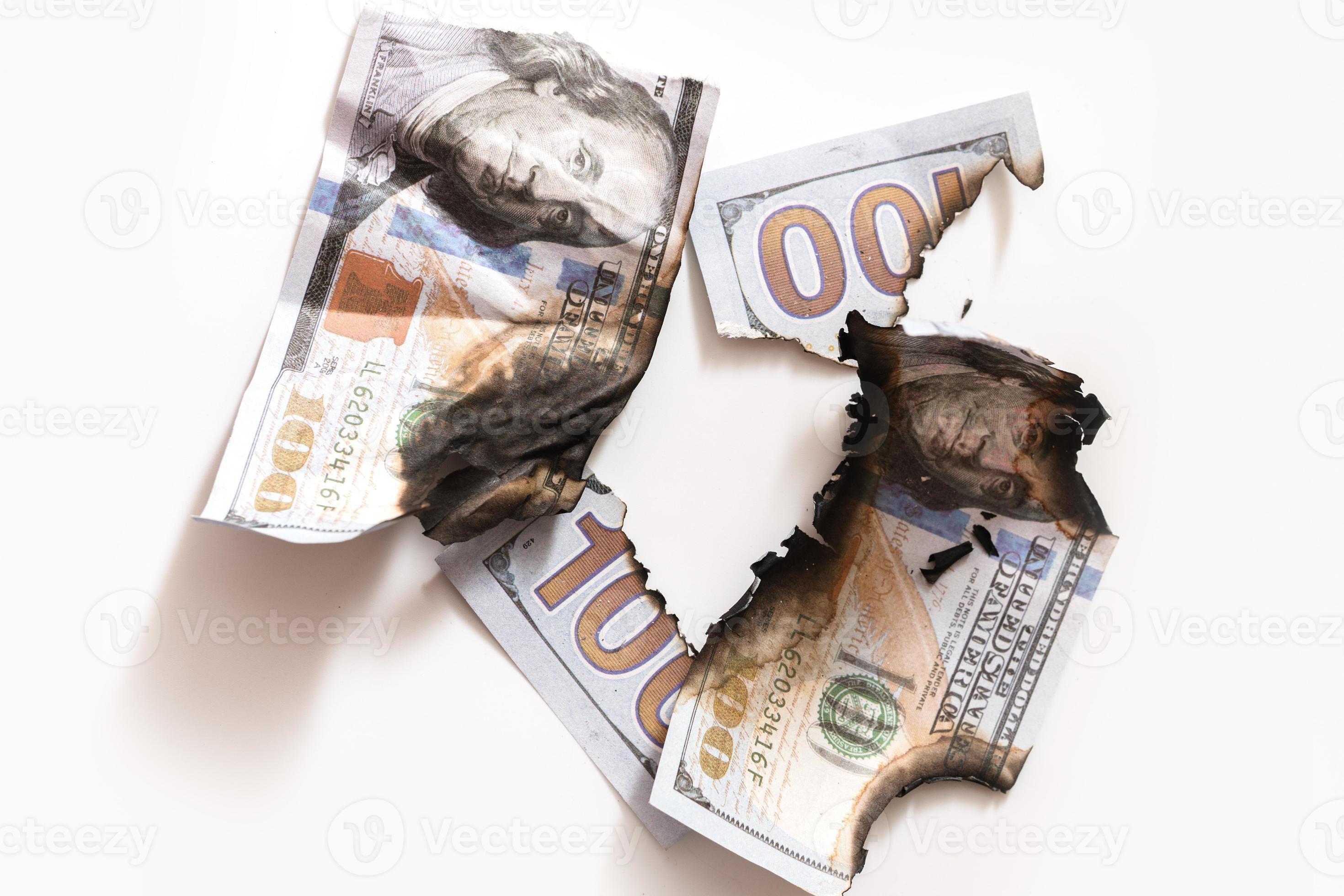 Closeup shot of torn and burnt one hundred dollar bills. 16289299 Stock