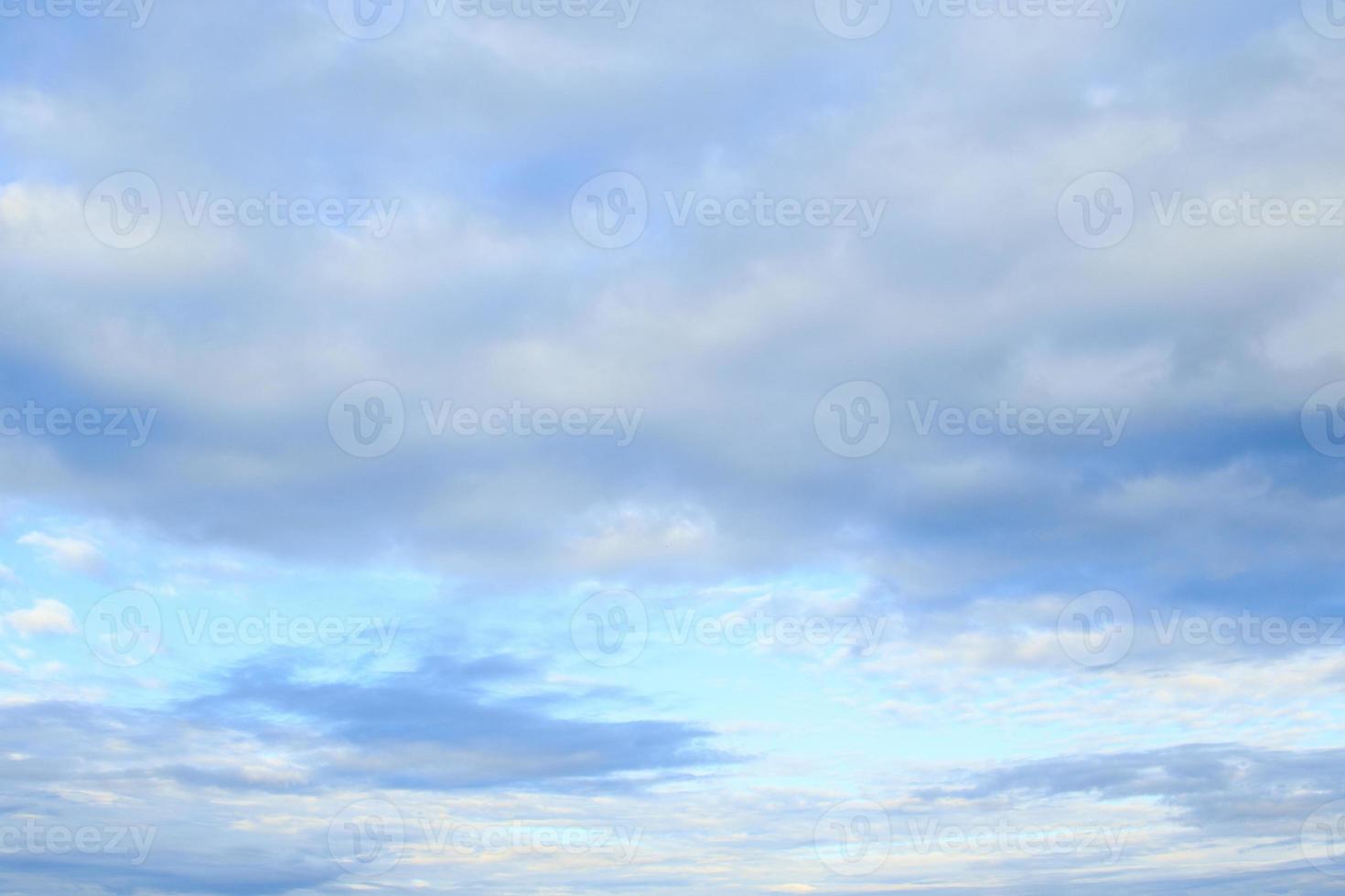 Beautiful tranquil blue sky with clouds photo