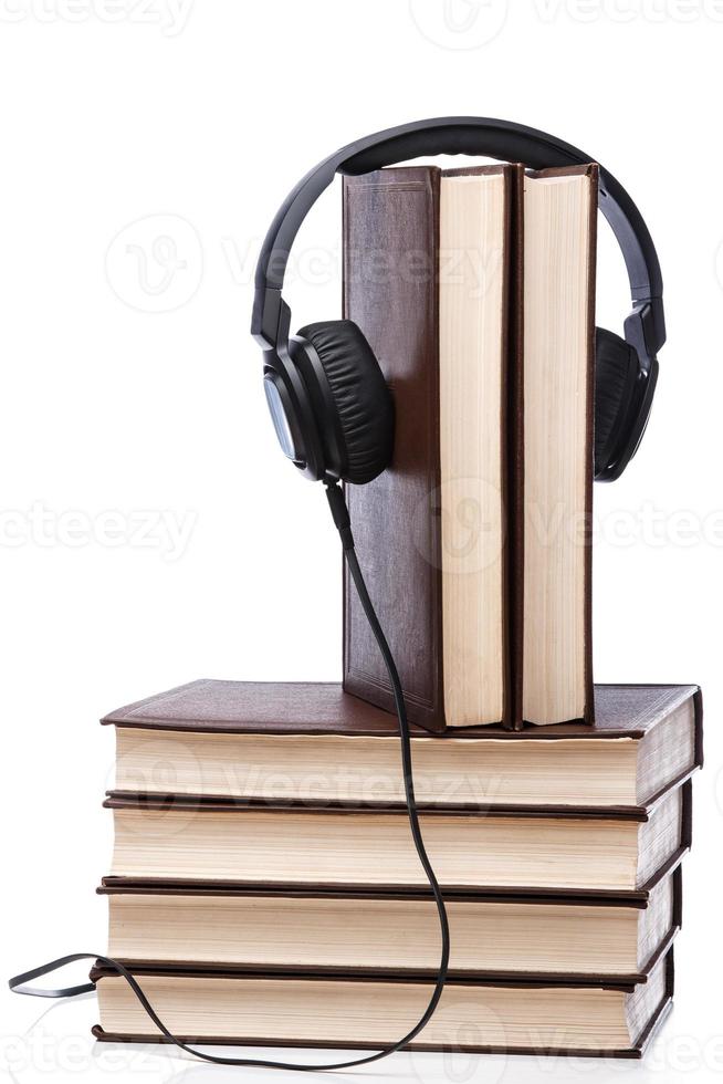 Audiobooks concept with books and headphone photo