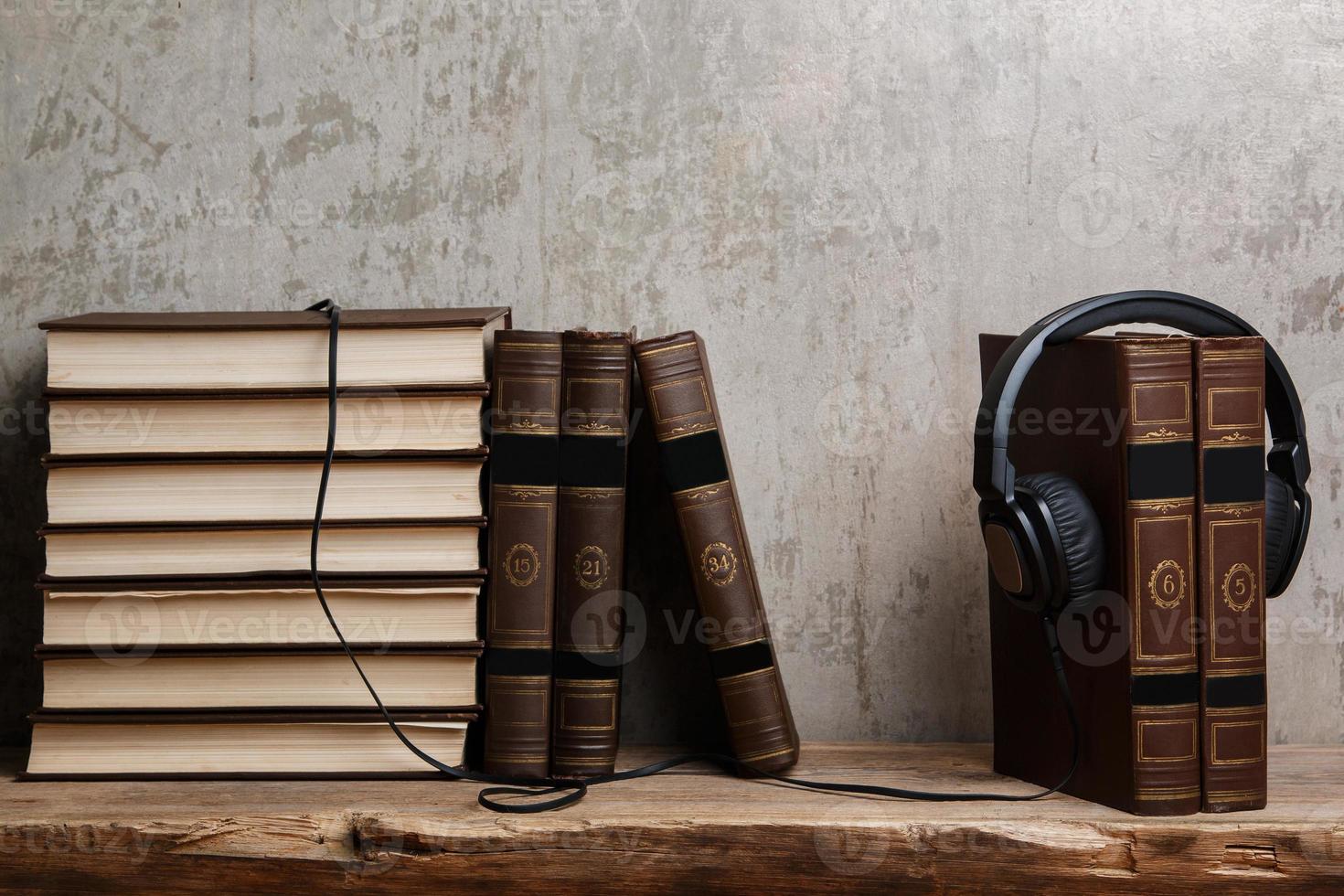 Audiobooks concept with books and headphone photo