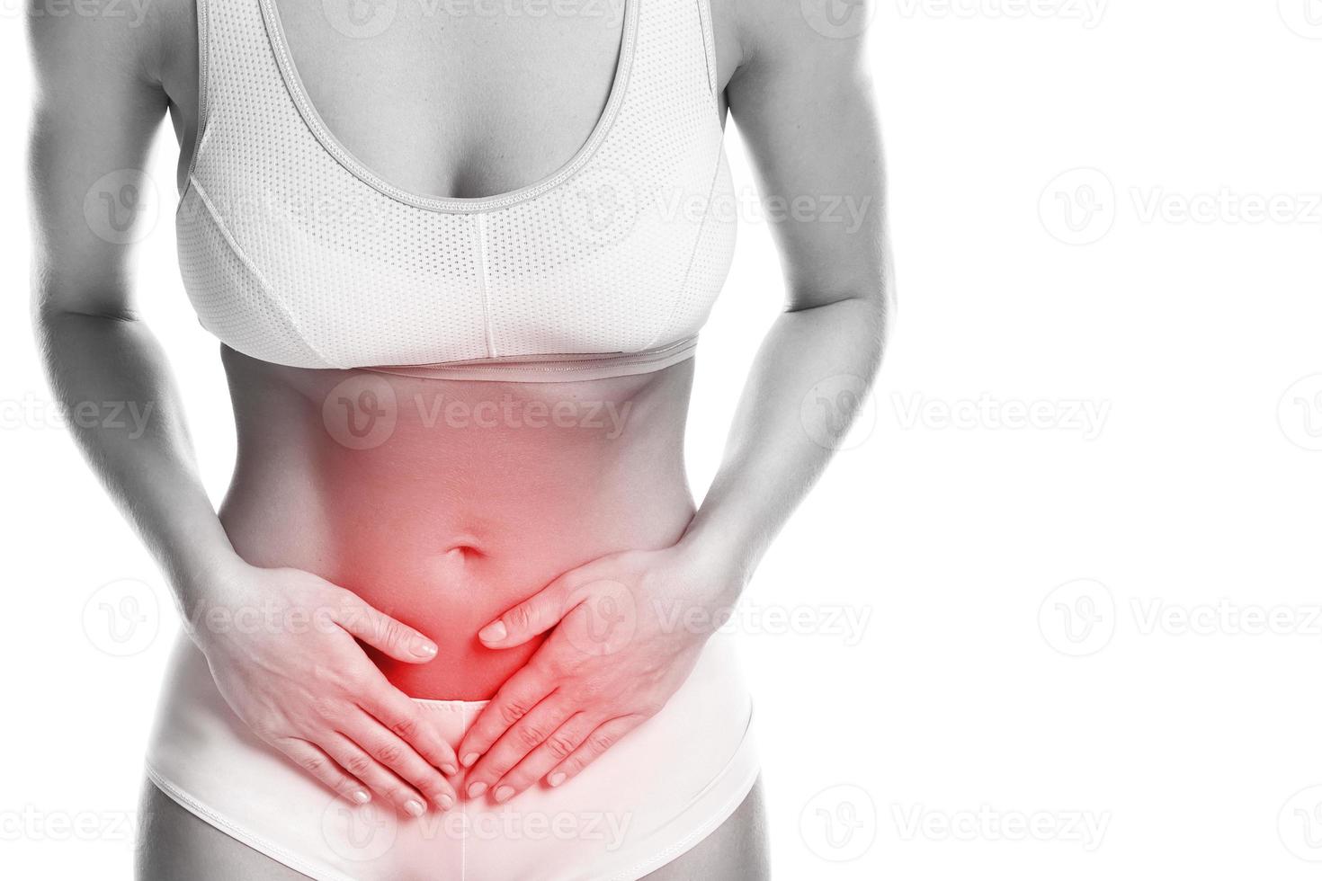 Woman is feeling pain in lower part of her stomach photo