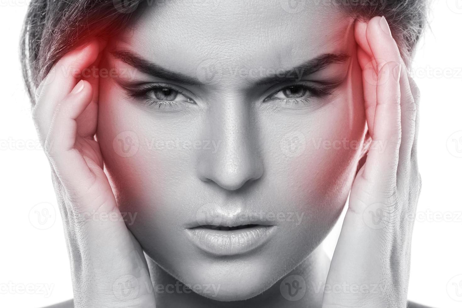 Woman with a source of red painful headache photo