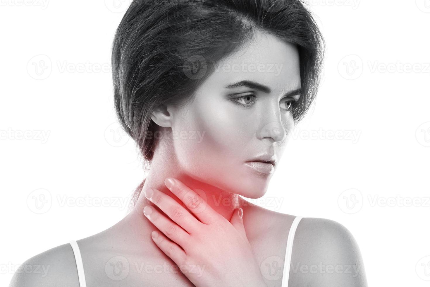 Woman with a pain in her throat photo