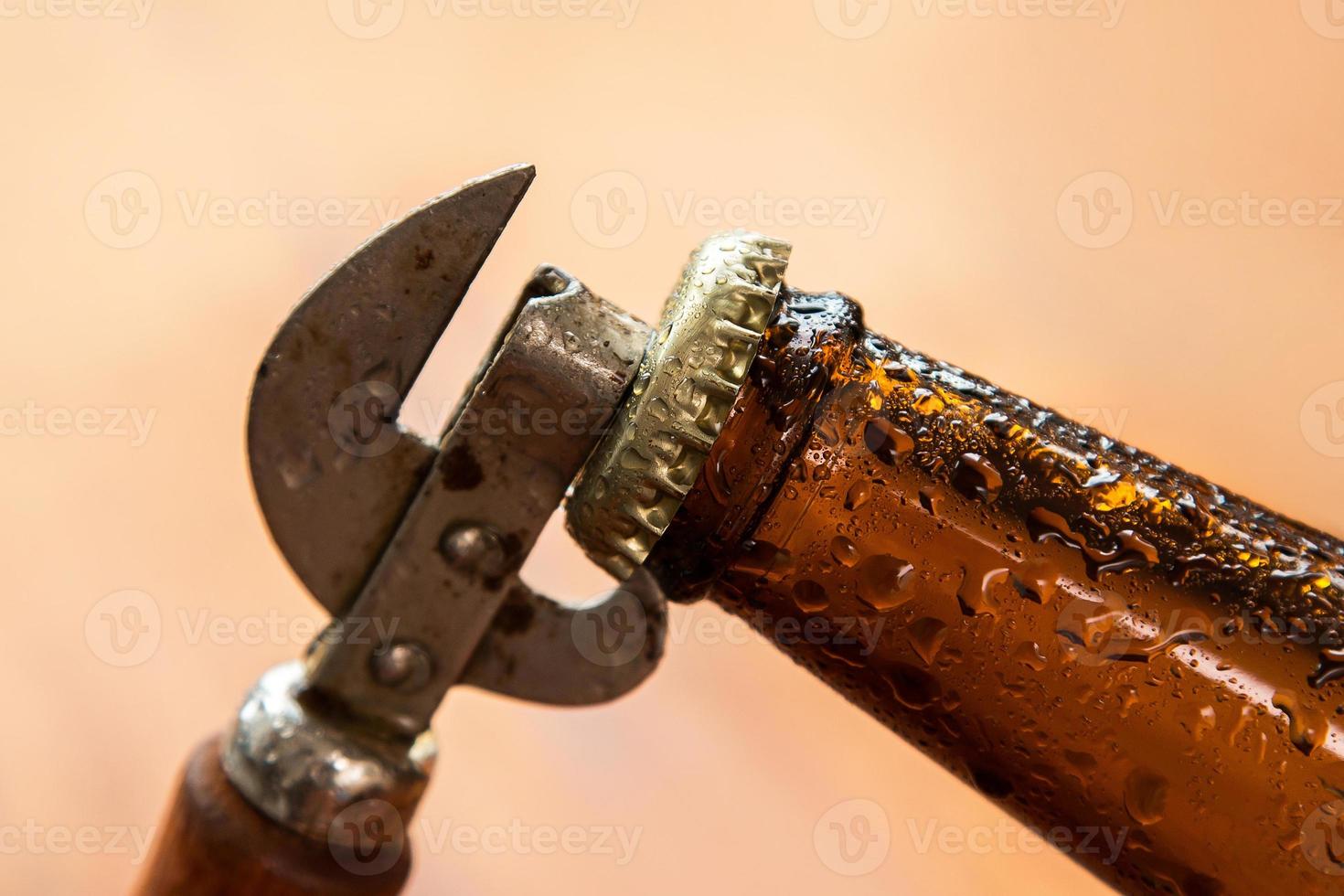 Vintage opener and beer photo