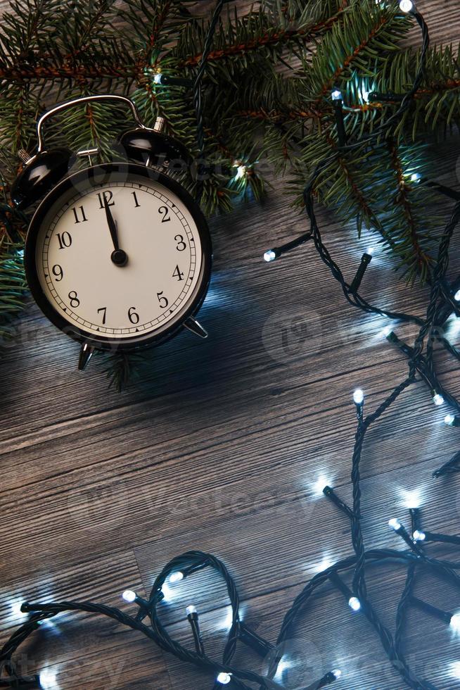 Alarm clock and christmas lights photo