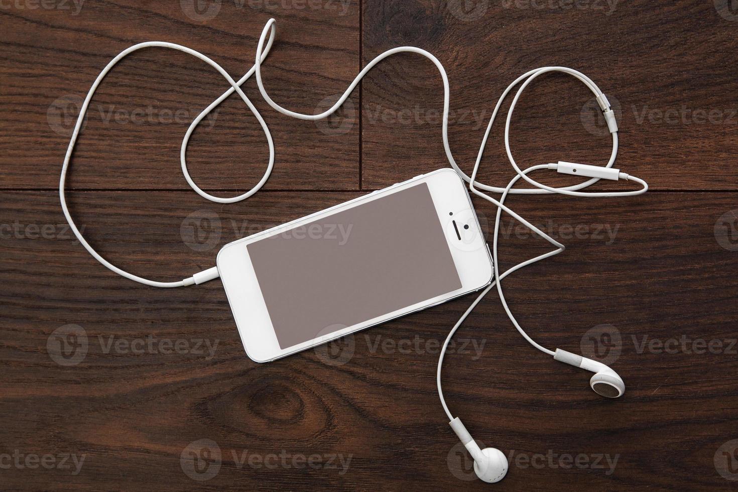 Smart phone and earphones photo