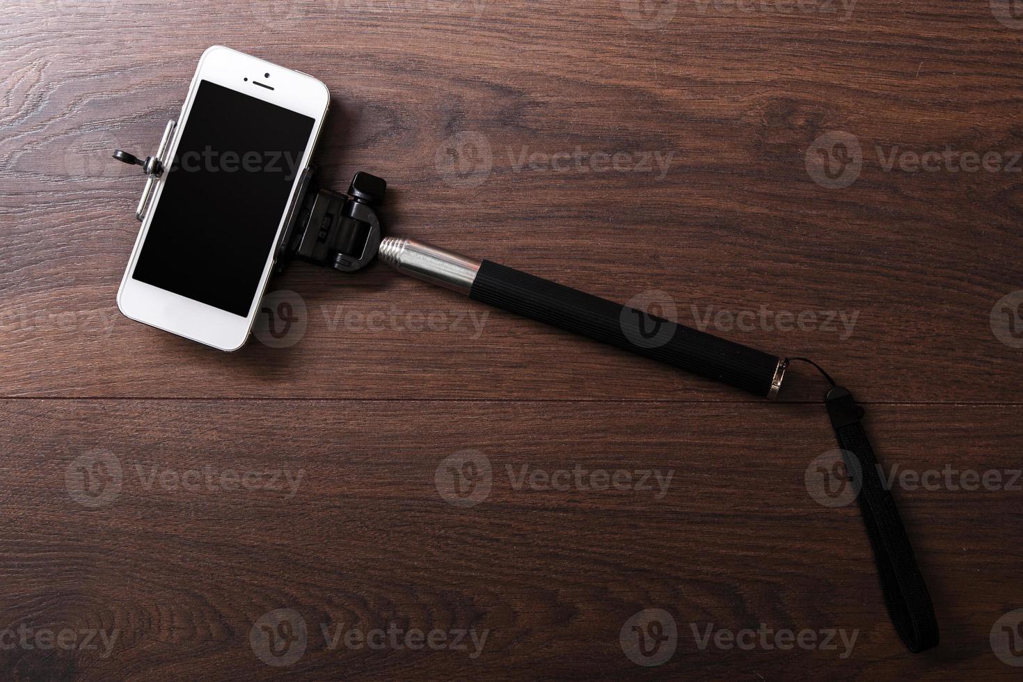 Smart phone and selfie stick photo