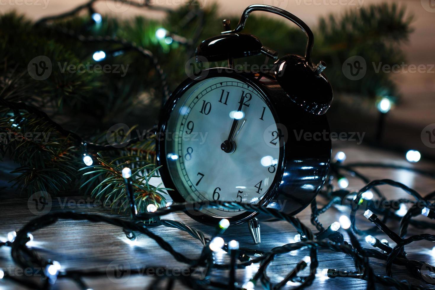 Alarm clock and christmas lights photo