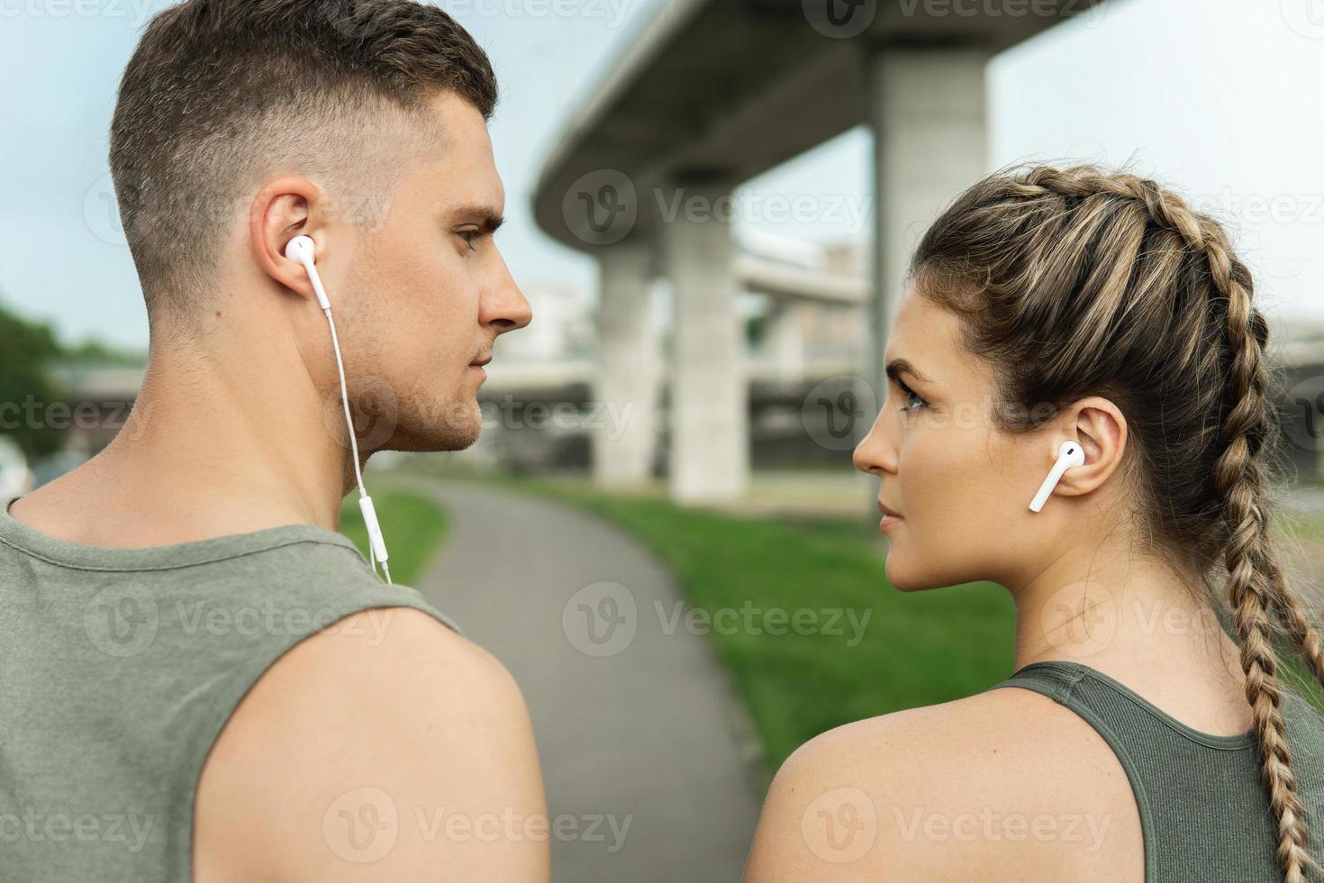 Confident athletic couple ready for street workout photo