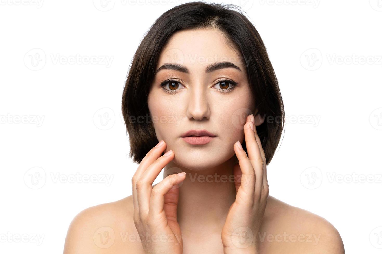 Portrait of young beautiful brunette woman against white photo