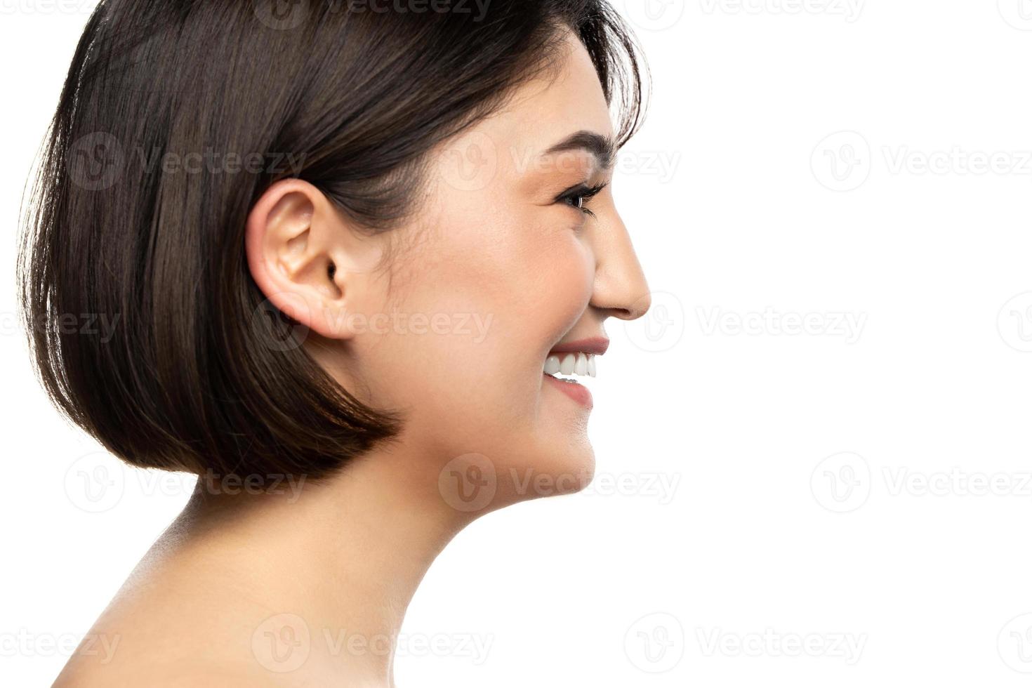 Portrait of young beautiful brunette woman against white photo