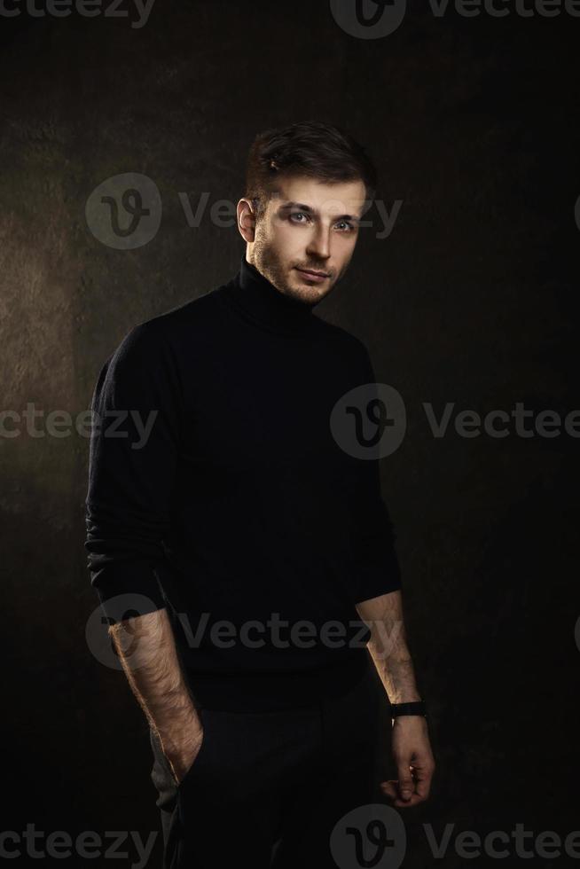 Young handsome man wearing a polo neck photo