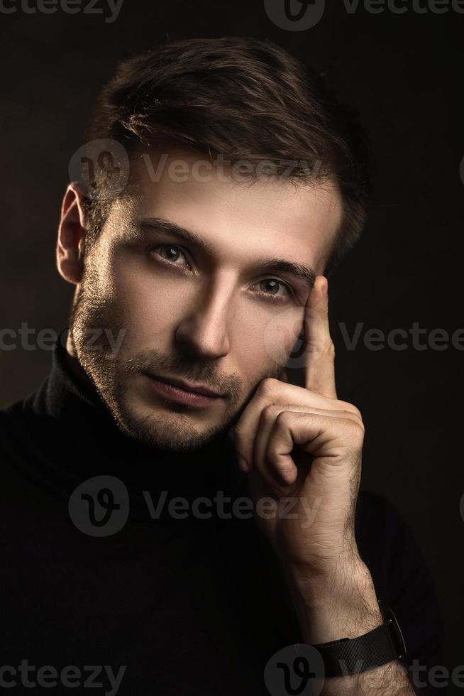 Young handsome man wearing a polo neck photo