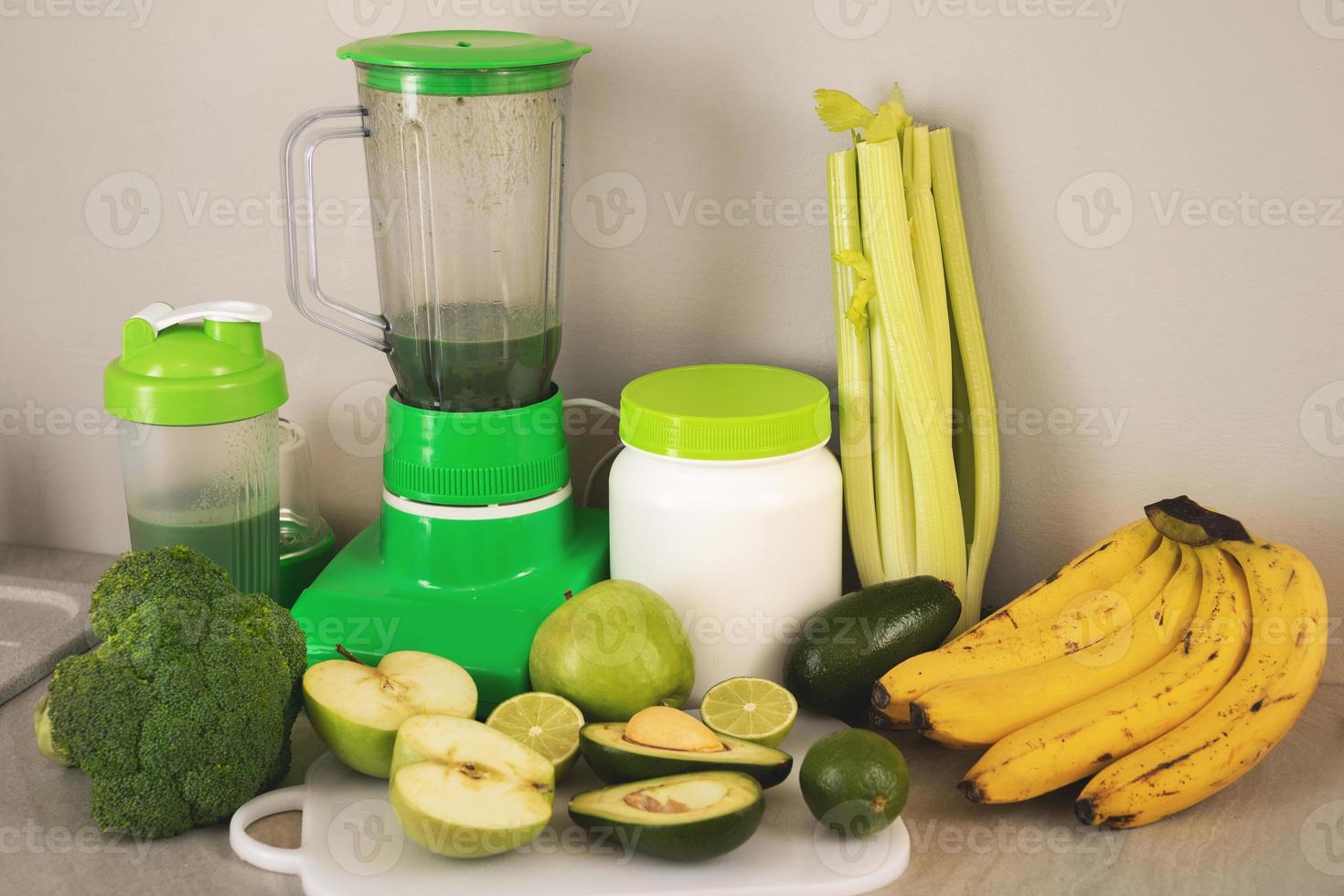Blender, ingredients for healthy homemade smoothie on kitchen table photo
