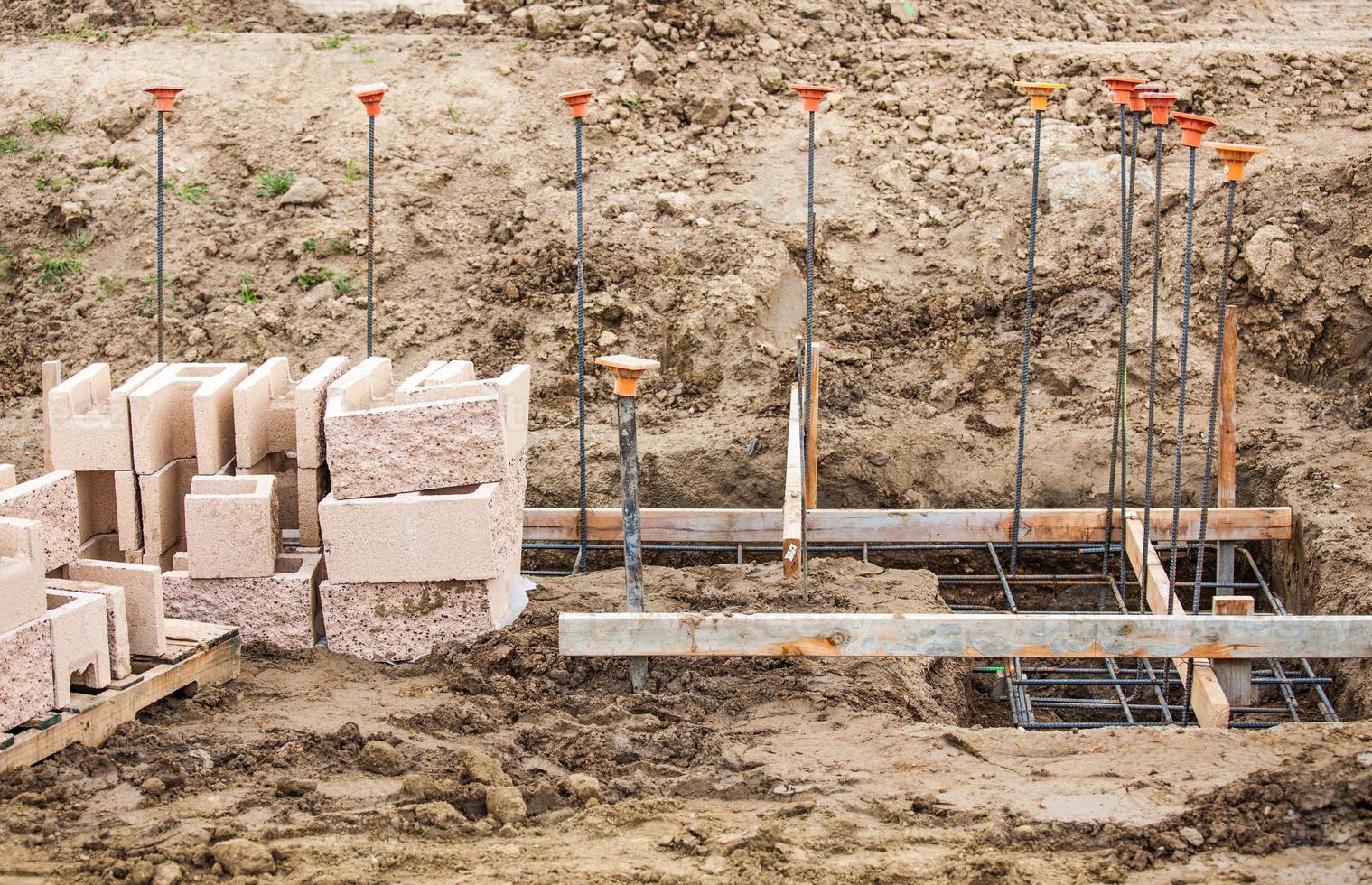 Details of a Construction Site with Concrete Blocks and Rebar. photo