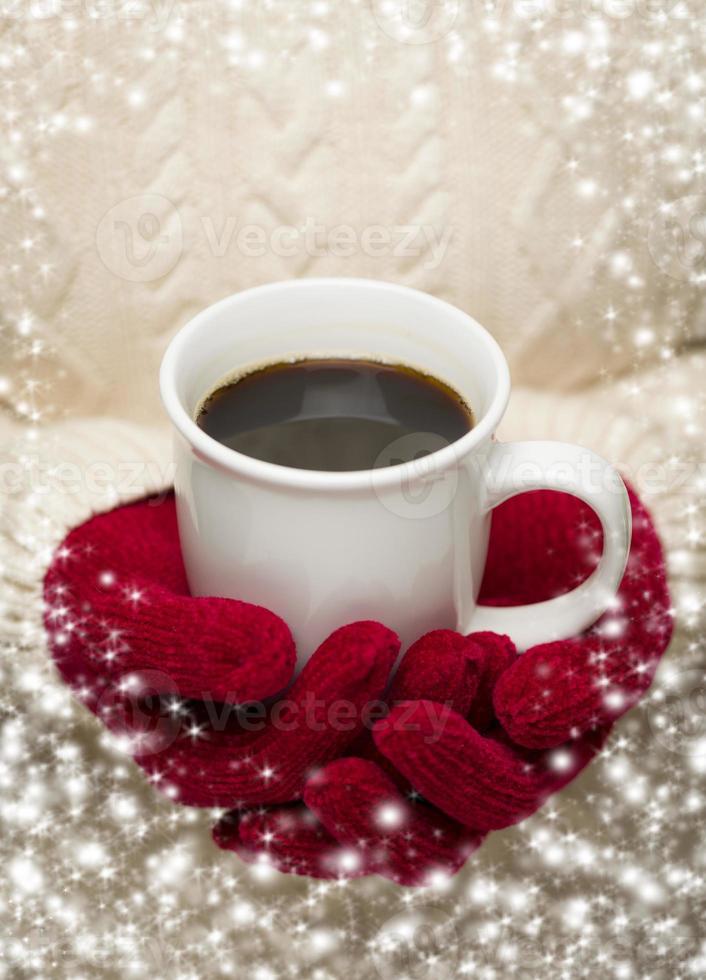 Woman in Sweater with Red Mittens Holding Cup of Coffee photo