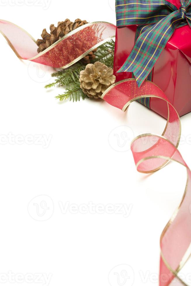 Christmas Present with Ribbon, Pine Cones and Pine Branches on White photo