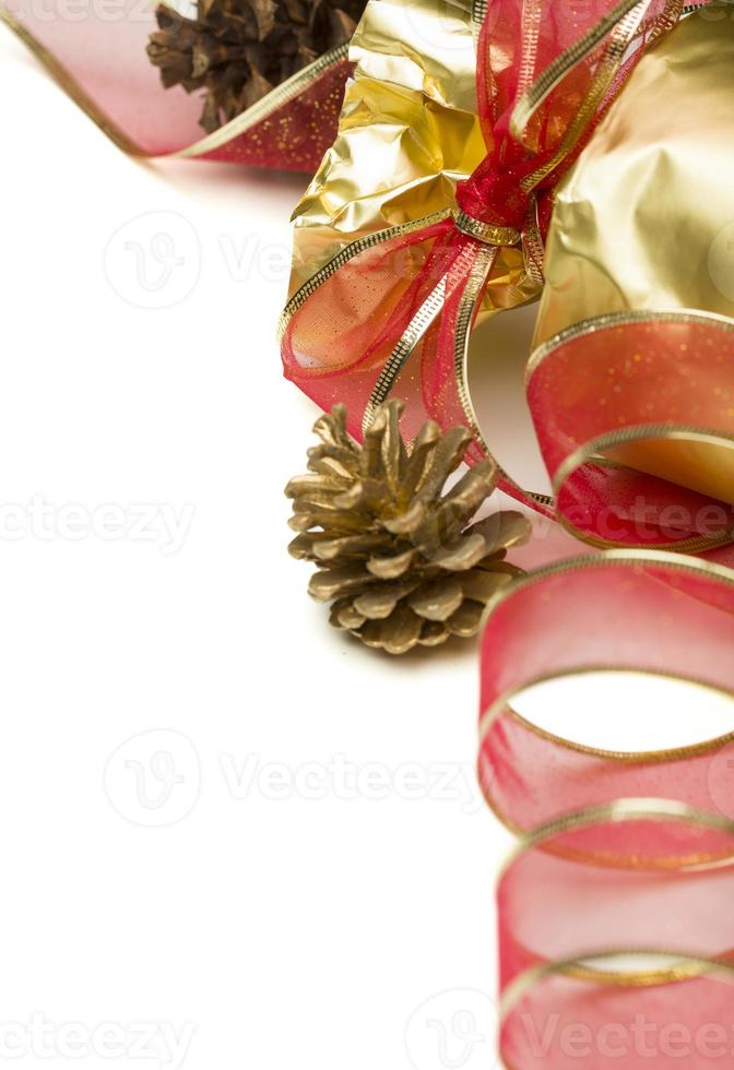Christmas Present with Red Ribbon and Pine Cones on White photo