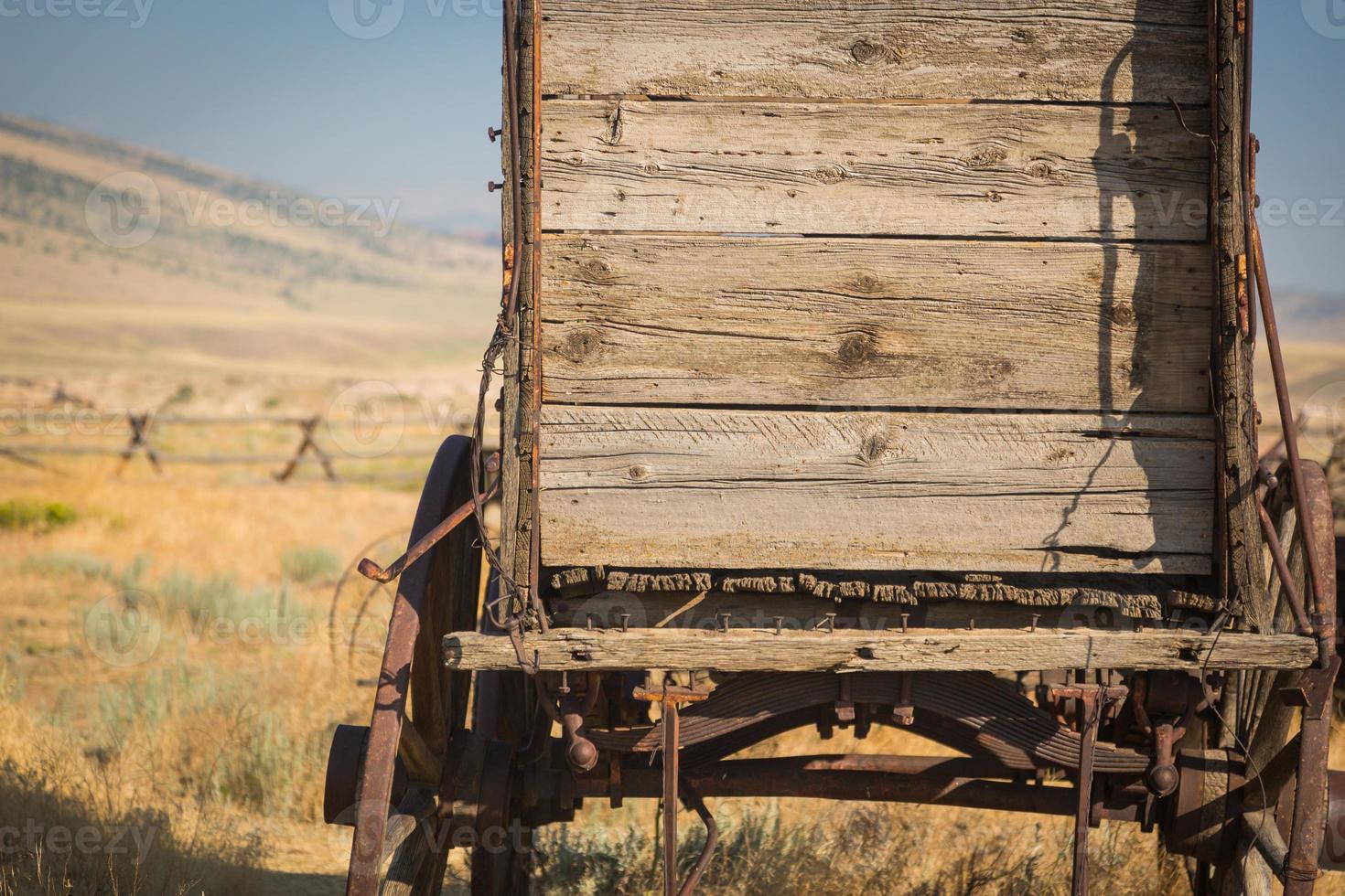 Abstract of Vintage Antique Wood Wagon In Meadow. photo
