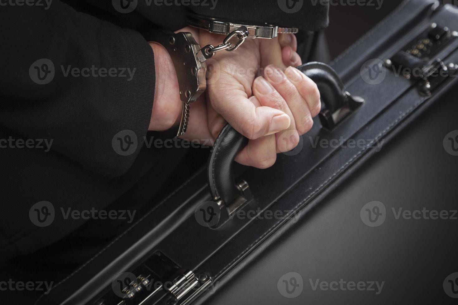 Woman In Handcuffs Carrying Briefcase photo