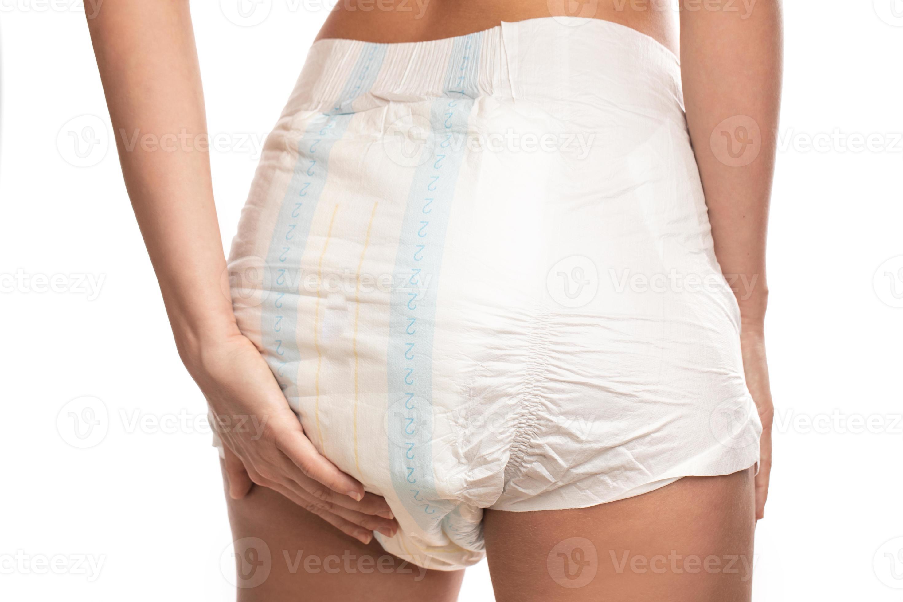 Woman wearing adult diaper against white background. 16293040 Stock Photo  at Vecteezy