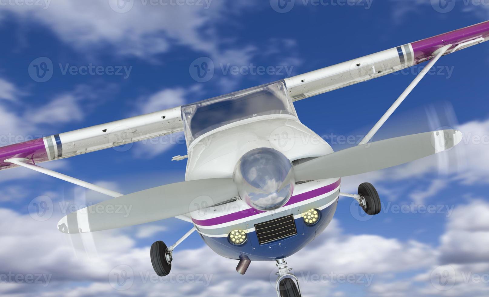 Front of Cessna 172 Single Propeller Airplane In The Sky photo