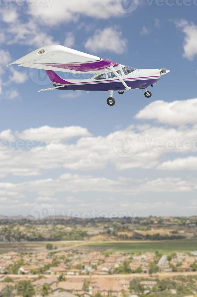 The Cessna 172 Single Propeller Airplane Flying In Sky photo