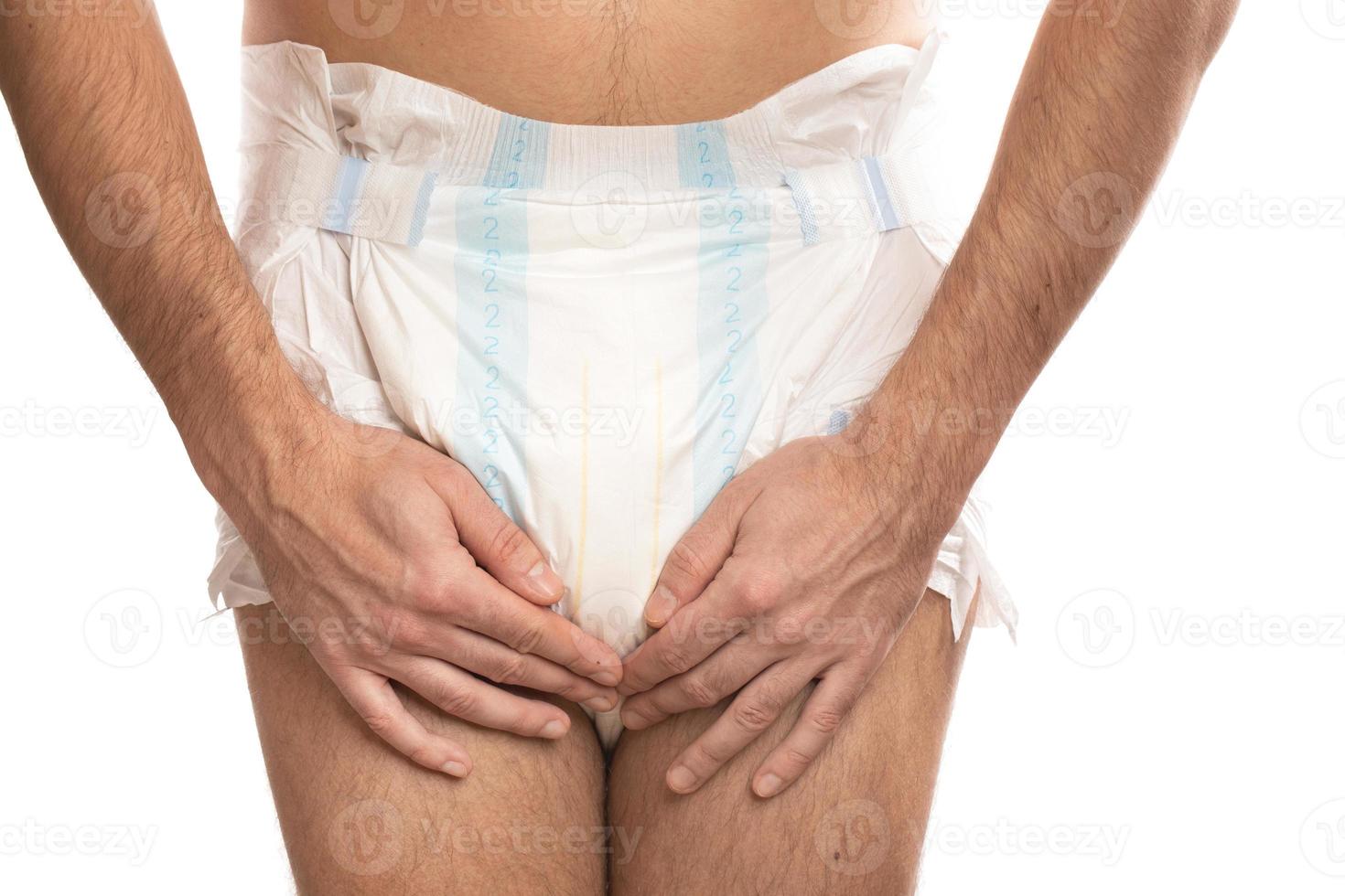 Woman wearing adult diaper against white background photo