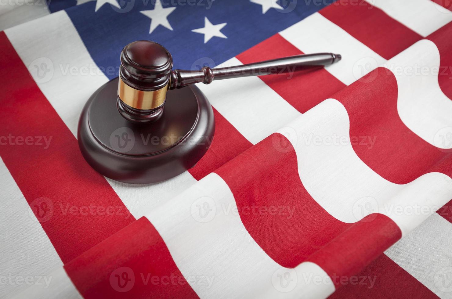Gavel Resting on American Flag photo