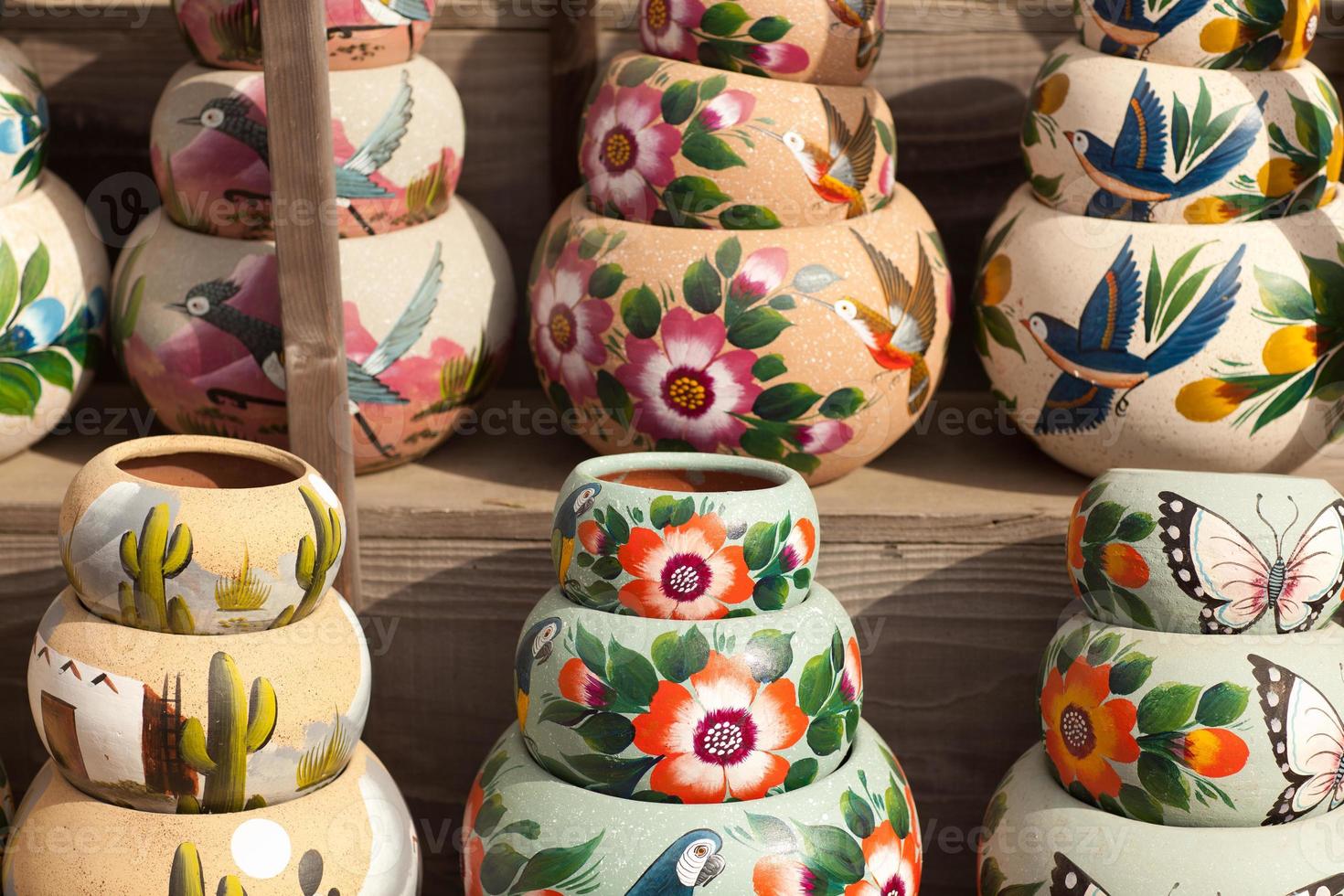 Variety of Colorfully Painted Ceramic Pots. photo