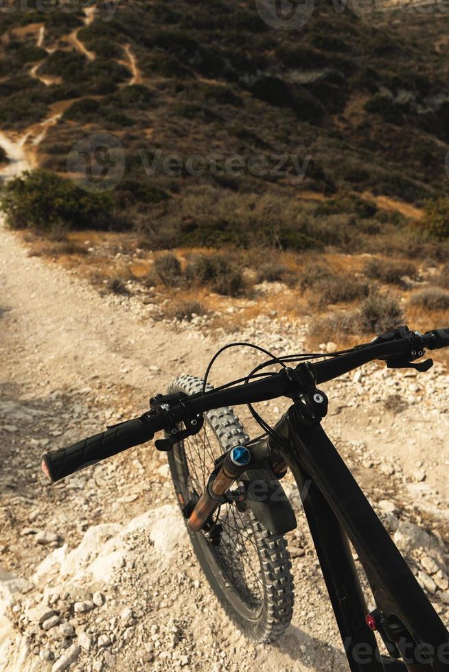 MTB bike on a top of a mountan before a downhill ride photo