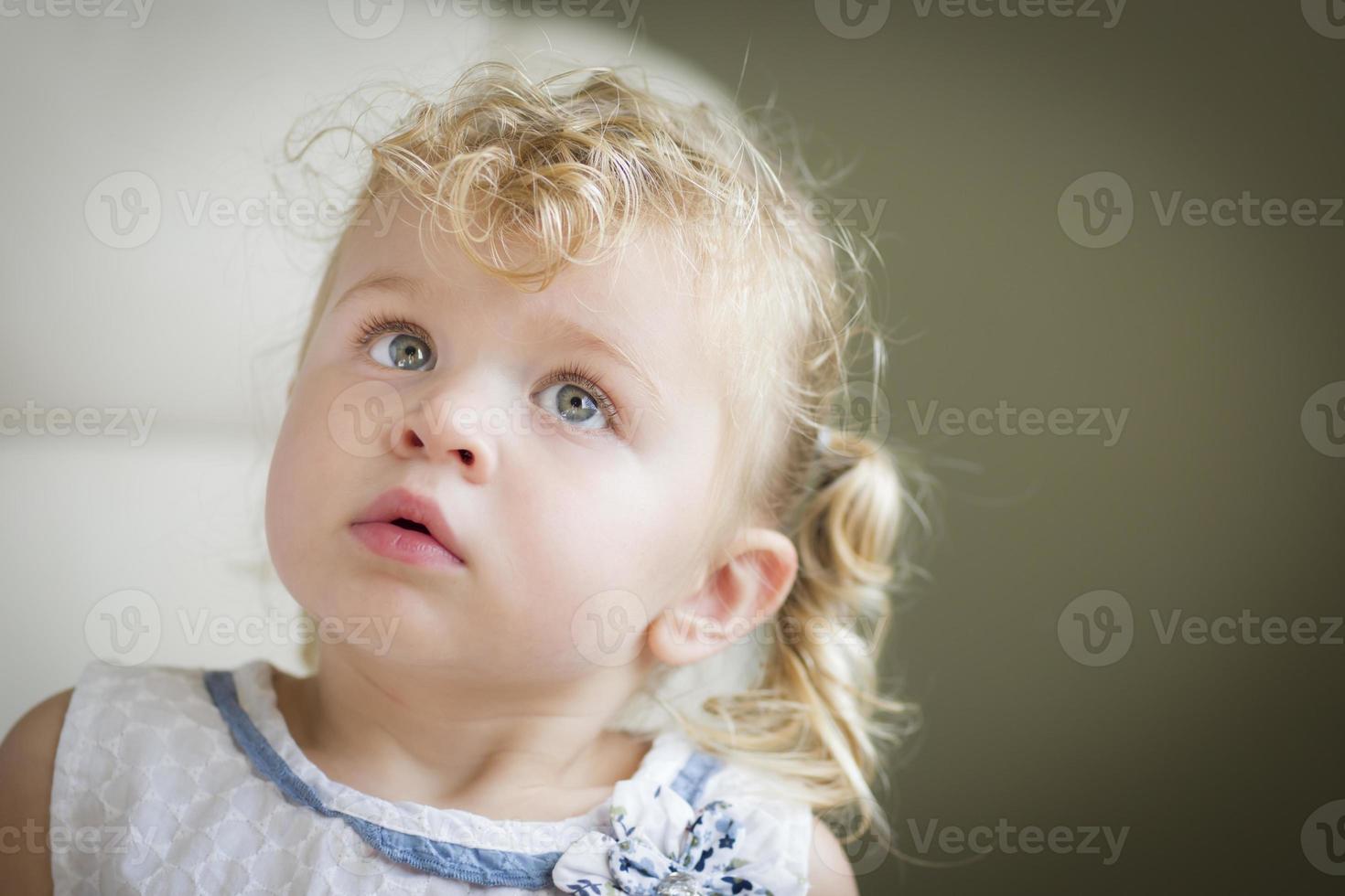 Adorable Blonde Haired and Blue Eyed Little Girl in Chair photo