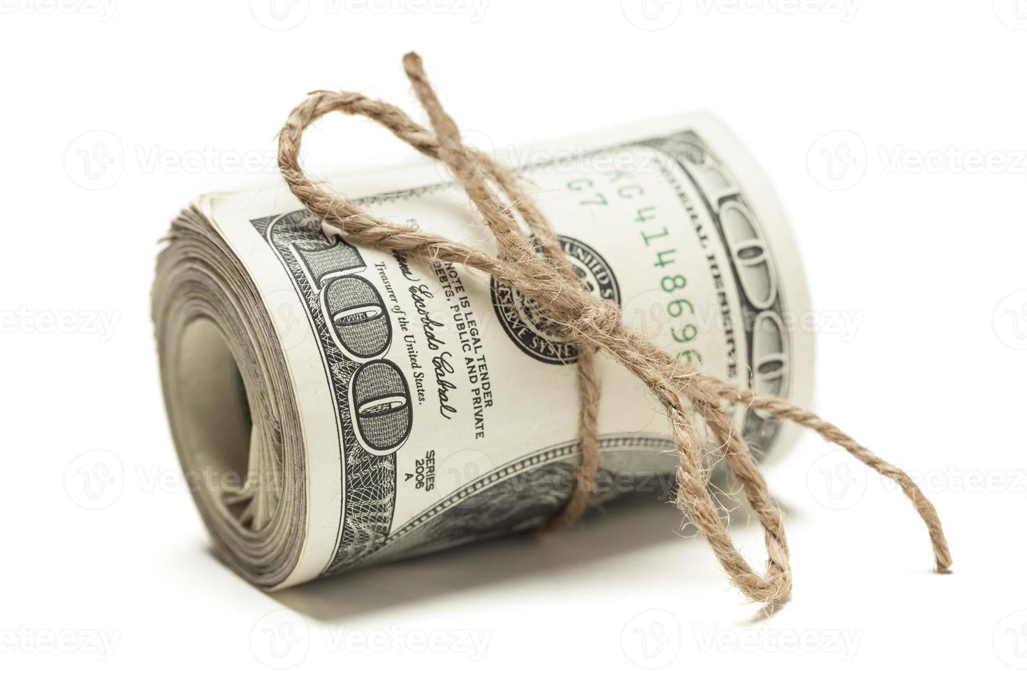 Roll of One Hundred Dollar Bills Tied in Burlap String on White photo