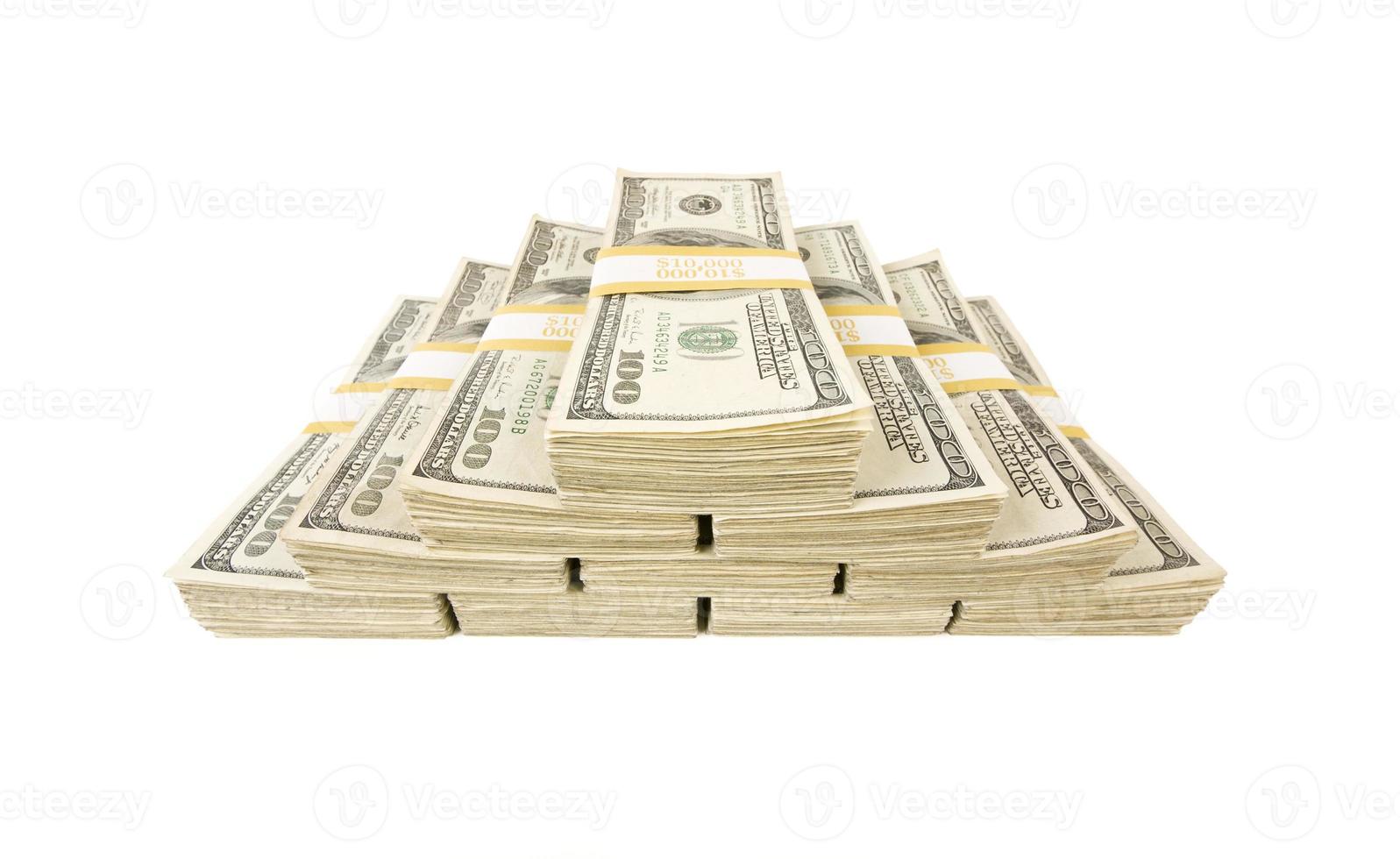 Stacks of One Hundred Dollar Bills on White photo